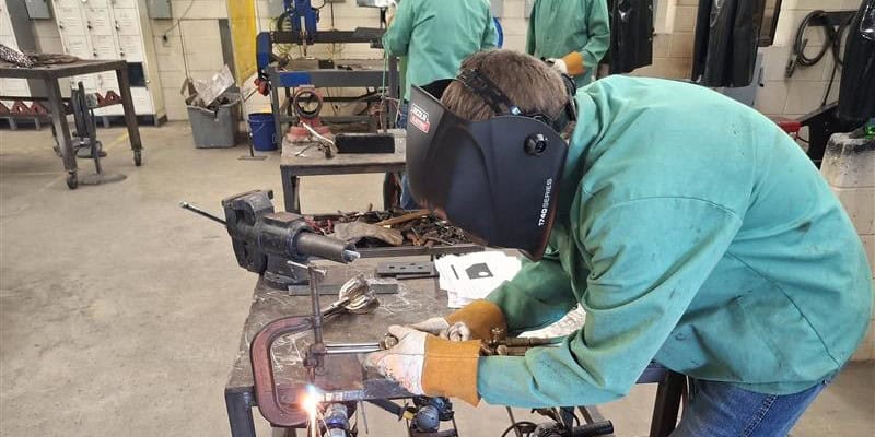 A Madison County student uses one of the new welding helmets
